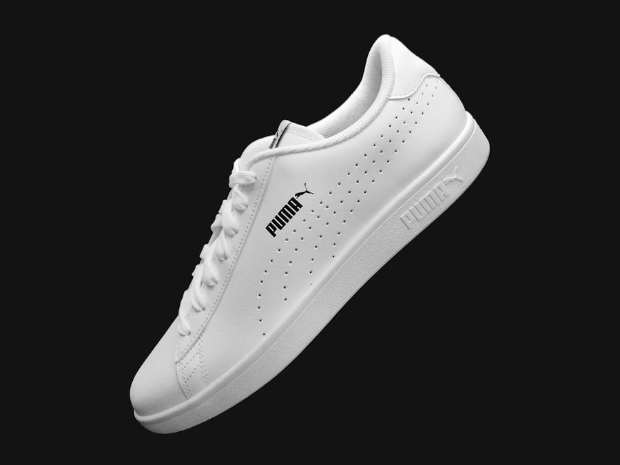 White trainer on a dark background